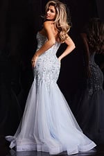 Model wearing Jovani 22924 blue mermaid gown, back view
