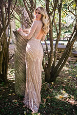 Side view of model wearing Jovani 23000 nude gown with beadwork