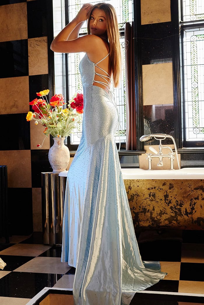 Model wearing Jovani 23010 Light Blue Low Back Embellished Dress