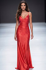 Fitted sequin gown with thin straps, plunging neckline, and smooth floor length silhouette that highlights clean, elegant lines