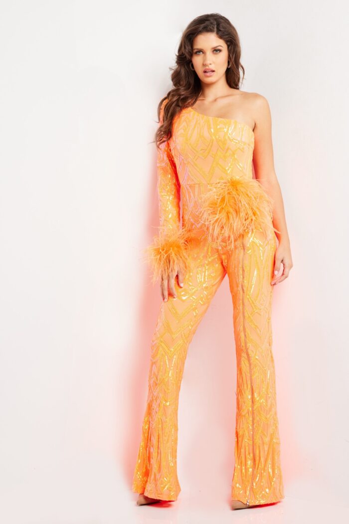 Model in Jovani 23026 orange jumpsuit with one shoulder and sequin designs.