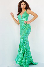 Model showcasing Jovani 23027 green gown with sparkling sequins, front view.
