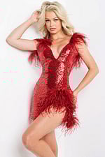 Model wearing Jovani 23059 red sequin dress with feather detailing, front view.