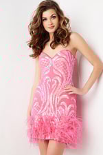 model wearing Jovani 23060 pink mini dress with sequin embellishments and feathered hem