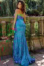 Model wearing 23077 blue sequin gown, back view