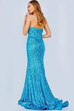 Model wearing 23077 blue sequin gown, side back view