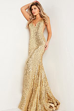 Model wearing Jovani 23079 gold sequin gown, front view