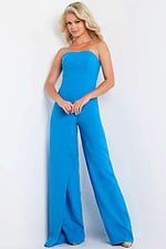 Model wearing Jovani 23082 blue strapless jumpsuit front view.