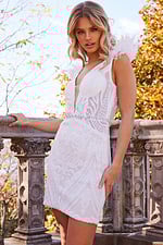 model wearing Jovani 23104 white sequin dress with feather detail