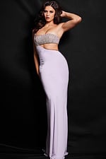 Model wearing Jovani 23128 lilac gown with an embellished bodice and asymmetrical neckline.