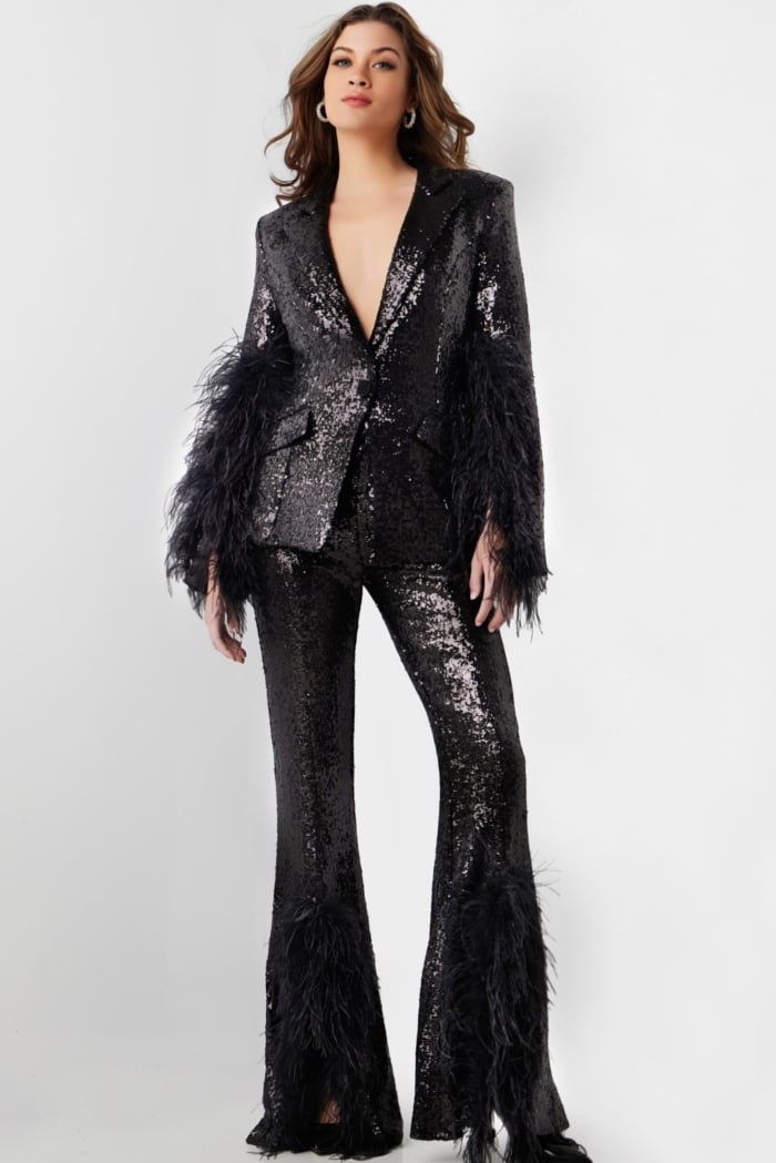 Model wearing Jovani 23162 black sequin outfit showing V-neckline