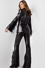 Back view of model in Jovani 23162 black sequin set with feathers