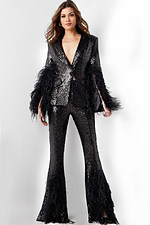 Model wearing Jovani 23162 black sequin ensemble with feather details