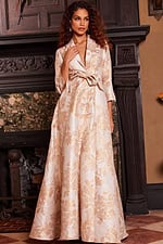 Model wearing Jovani 23178 full-length gold dress with blazer neckline