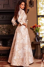 Model wearing Jovani 23178 gold floral brocade dress side view