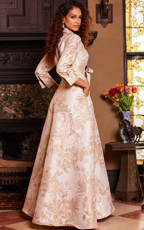 Back view of model wearing Jovani 23178 gold dress with floral pattern