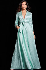 Model wearing Jovani 23179 mint dress, front view with V-neckline and belt.