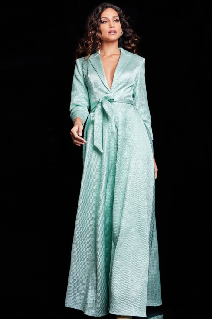 model wearing Jovani 23179 mint dress highlighting V-neck design