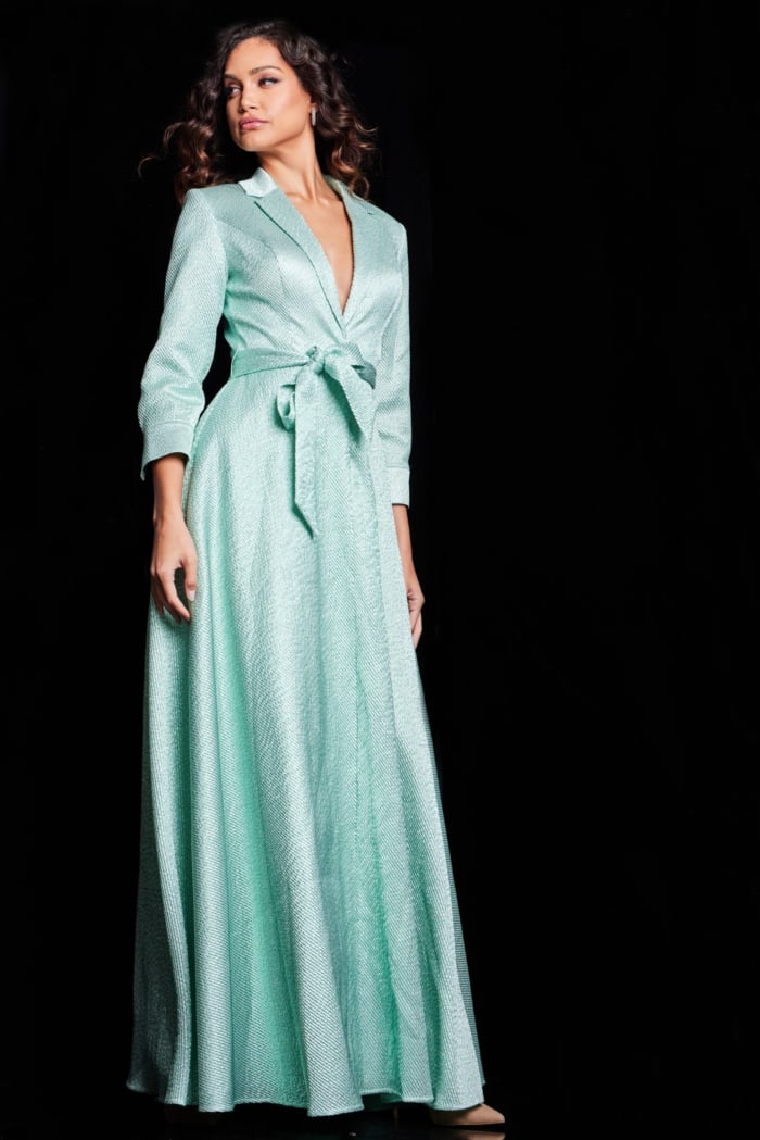 model in Jovani 23179 mint gown showing full-length A-line style