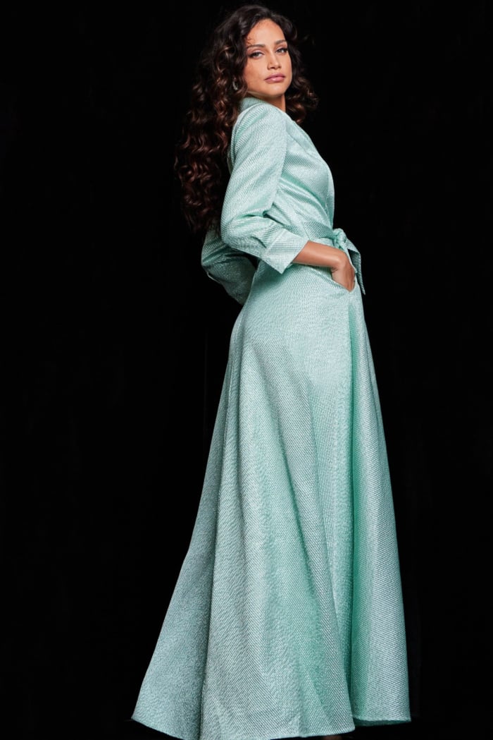 model wearing Jovani 23179 mint dress, back view with tailored sleeves