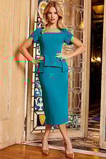 Model in Jovani 23189 teal dress, front view highlighting square neckline and short sleeves.