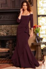 model wearing Jovani 23190 purple dress with off-shoulder neckline and three-quarter sleeves