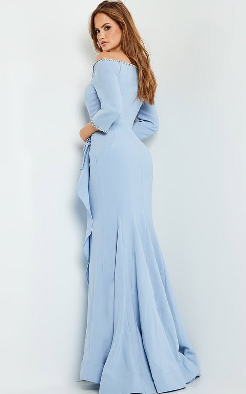 Back view of model wearing Jovani 23190 in light blue, highlighting elegant draping and fitted mermaid style.