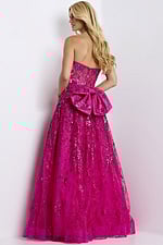Strapless pink sequin ball gown with large bow accent and sheer corset bodice