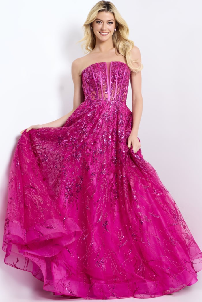 Elegant strapless prom gown featuring sparkling embroidery and dramatic bow detail
