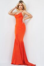 Model in Jovani 23201 orange gown featuring detailed beading on sweetheart neckline