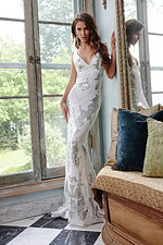 Model in Jovani 23319 ivory dress featuring a sophisticated silhouette