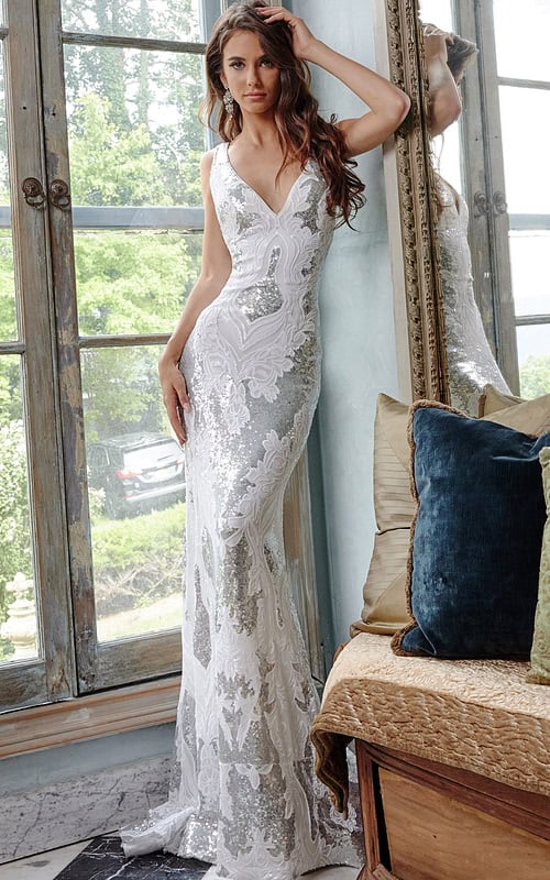Model wearing Jovani 23319 ivory gown with sequins and intricate details
