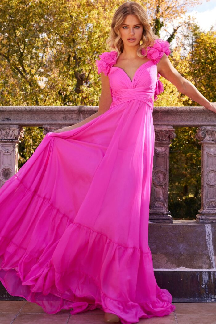 Model wearing Jovani 23322 pink dress with layers and floral accents