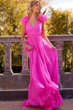 Model in Jovani 23322 pink dress, floral appliqué details and layered skirt