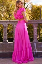 Back view of model wearing Jovani 23322 pink dress with open back and flowing skirt
