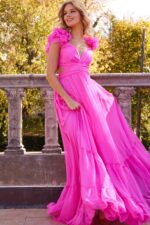 Model wearing Jovani 23322 pink dress with sweetheart neckline and floral appliqué sleeves