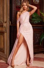 Model wearing Jovani 23396 blush gown with intricate beadwork and high slit