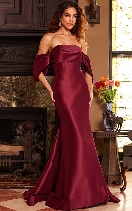 Model wearing Jovani 23398 burgundy dress, front view with off-the-shoulder style.