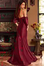 Back view of model in Jovani 23398 burgundy dress, displaying elegant back design.
