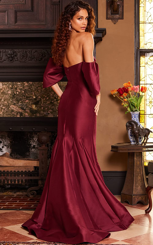 Back view of model in Jovani 23398 burgundy dress, displaying elegant back design.