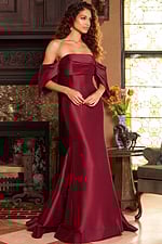Model in Jovani 23398 burgundy gown, highlighting the mermaid silhouette.