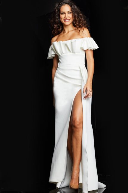 Model wearing Jovani 23402 white off-the-shoulder dress with ruffles and high slit in front view