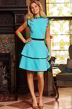 Model wearing Jovani 23521 full-length A-line dress in blue with layered skirt.