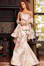 Model in Jovani 23624 gold gown showing off-shoulder detail, front view