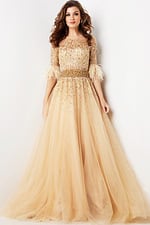 Model wearing Jovani 23629 elegant beige gown with sequined bodice and feathered sleeve details.