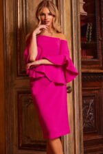 Model wearing Jovani 23645 fuchsia dress with off-the-shoulder neckline and bell sleeves in a close-up view.