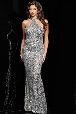 Model wearing Jovani 23652 silver long dress with halter neckline and crystal embellishments, angled front view.