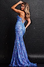 Model showcasing the back view of Jovani 23676 blue gown featuring lace-up detailing.