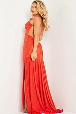 Model wearing Jovani 23688, orange gown, side view, open back, high slit