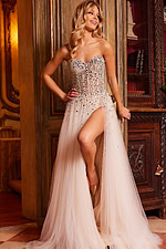 Model wearing Jovani 23712 nude dress with embellished bodice and high slit.